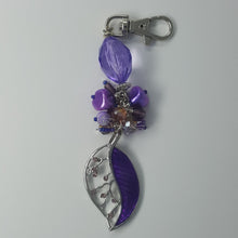 Load image into Gallery viewer, Planner/purse charm. Silver leaf pendant with purple stone inlay accompanied by mixed media beads, silver findings and lobster clasp.