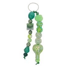 Load image into Gallery viewer, Green cord stacked with shaped beads in varying shades of greeen