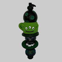 Load image into Gallery viewer, Handmade Midnight Black Luxe Pillar purse charm with a green alien teacup focal and moving circular wood "orbit" beads, quirky sci-fi themed tactile planner accessory.