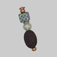 Load image into Gallery viewer, Handmade "Reign or Shine" Luxe Pillar purse charm on rose gold, featuring a checkered glass cube, sparkling rhinestone spacers, and a textured royal purple focal bead.