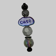 Load image into Gallery viewer, Handmade "Simply Irresistible" black Luxe Pillar purse charm featuring a faceted transparent crystal focal bead and mixed matte/glossy black accents on midnight black hardware.