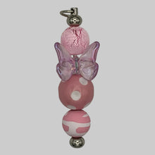 Load image into Gallery viewer, Handmade "Social Butterfly" silver Luxe Pillar purse charm featuring a spinning iridescent purple butterfly bead and pink cracked-ice accents, a tactile Y2K-inspired planner accessory.